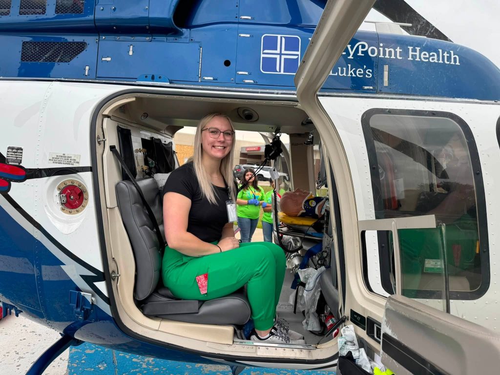 Savannah at Scrubs Camp in helicopter