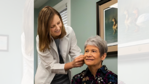 Dr checking hearing on patient