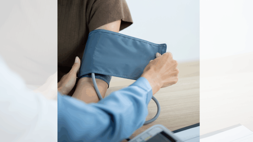 woman checking patient blood pressure and dr visit