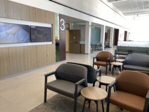New clinic waiting room with chairs and tv