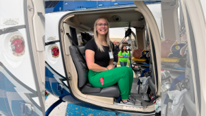 Savannah at Scrubs Camp in helicopter